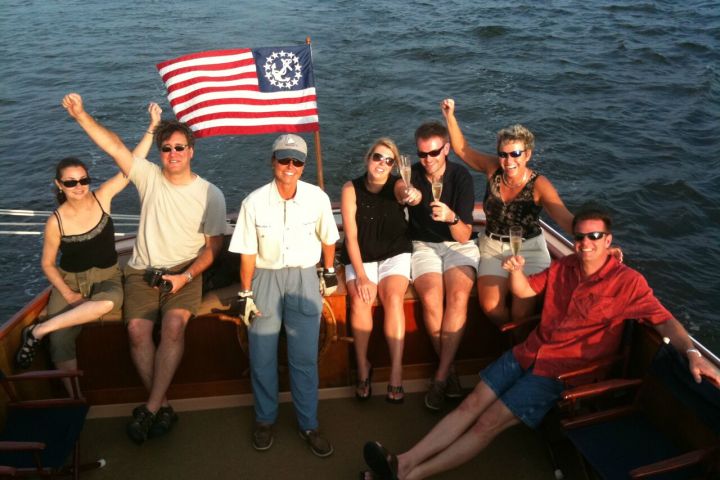group on the back of the sailboat