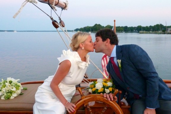 Experience the enchantment and bliss of a new marriage aboard Sail Selina in St. Michaels, MD - Capturing cherished moments like this is what makes sailing with us unforgettable - Book your Sail Selina adventure now!