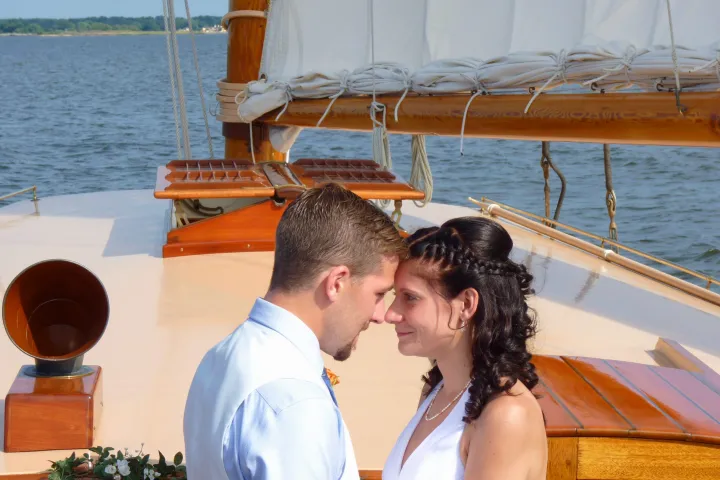 Experience the romance and adventure of a boat wedding or elopement aboard Sail Selina in St. Michaels, MD - Capturing the captivating and vibrant spirit of a newly-wed couple just like this - Book your Sail Selina adventure today!