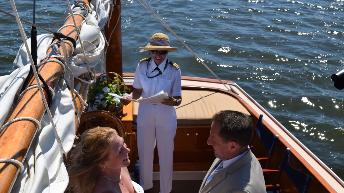 captain iris performing wedding ceremony on the selina II