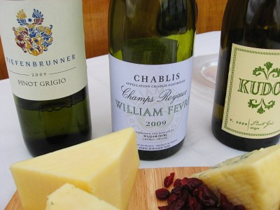 a bottle of wine and a glass of beer on a table