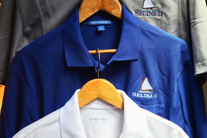 collectable Sail Selina custom logo embroidered on whit polo shirts, royal polo shirts and gray polo shirts. available in the ships store