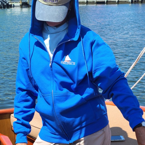 Sail Selina St Michaels custom embroidered logo on a royal blue zip hoodie abailable for sale in our ships store