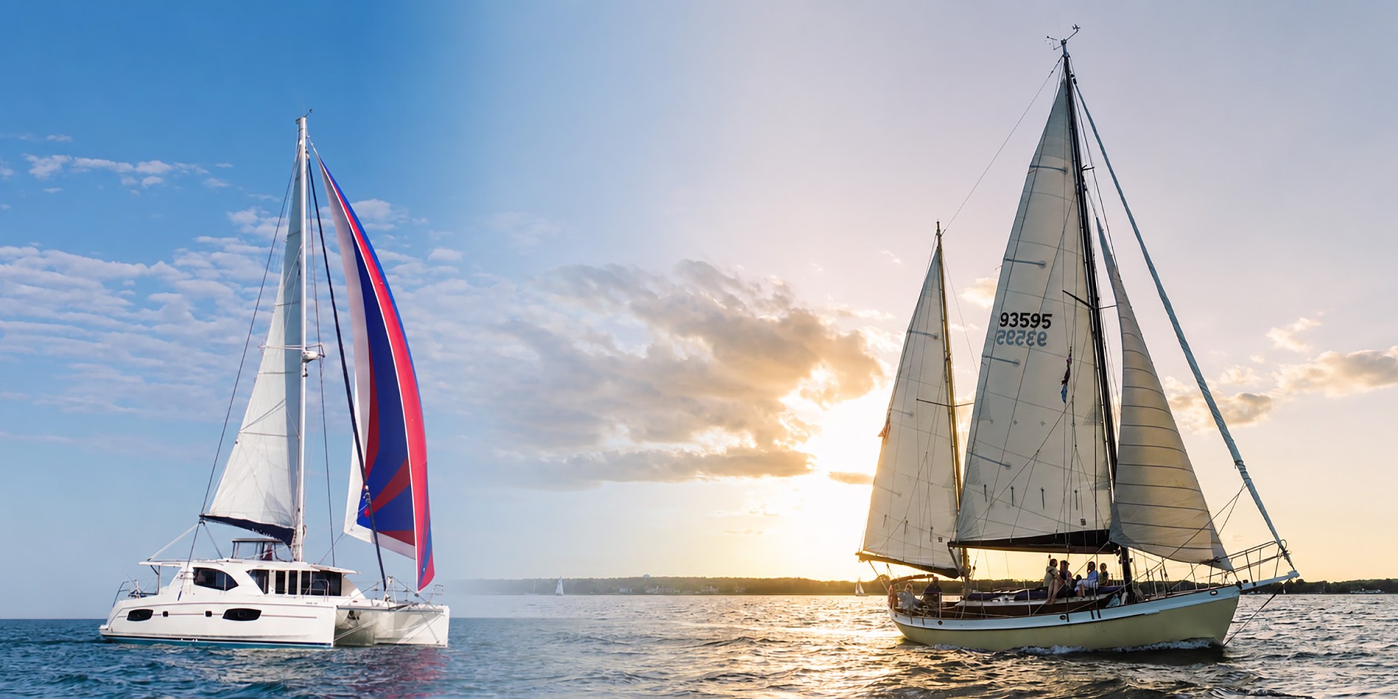 Two sailboats on the ocean at dawn with clear skies.